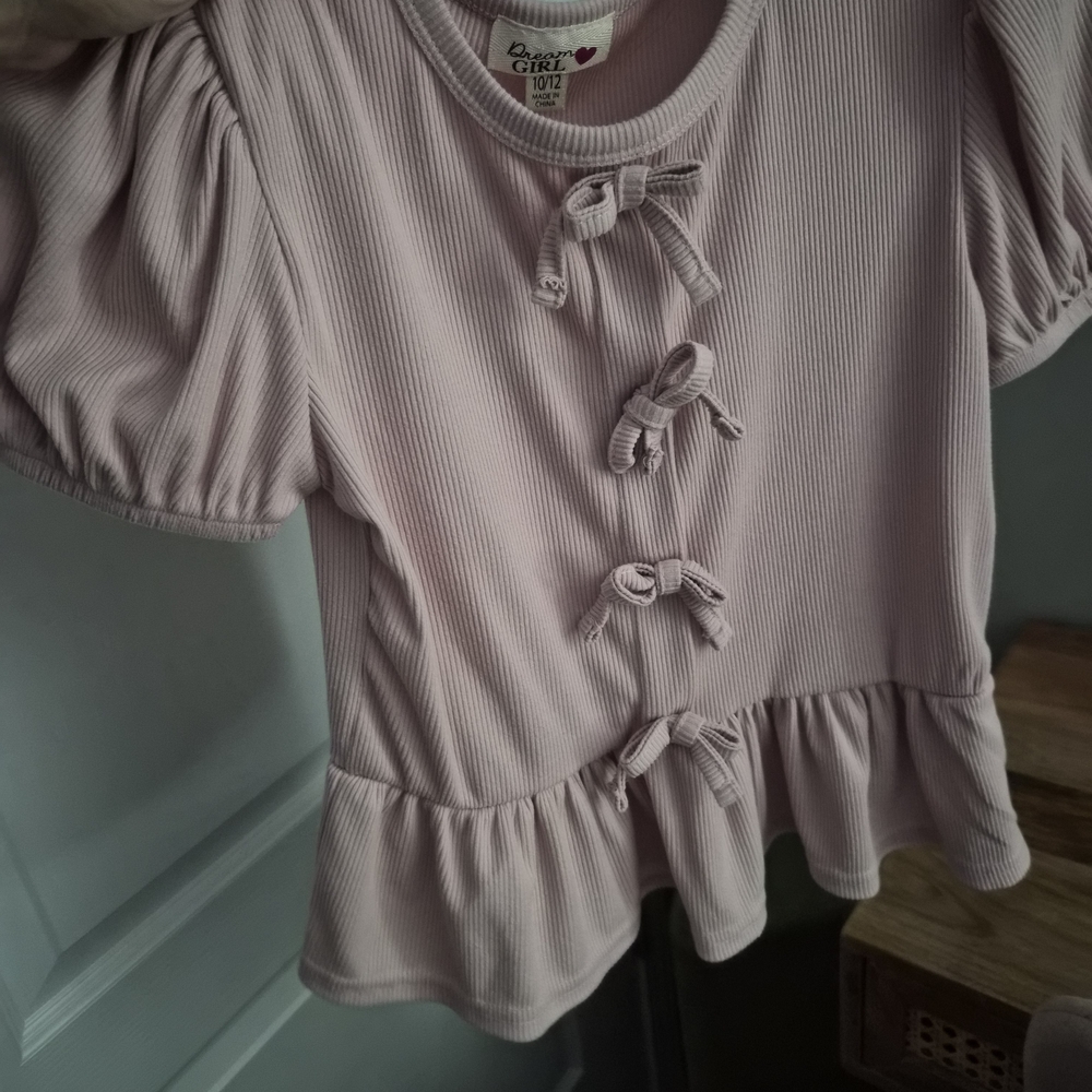 Dreamgirl Pale Pink Ribbed Peplum Top with Front Bows
